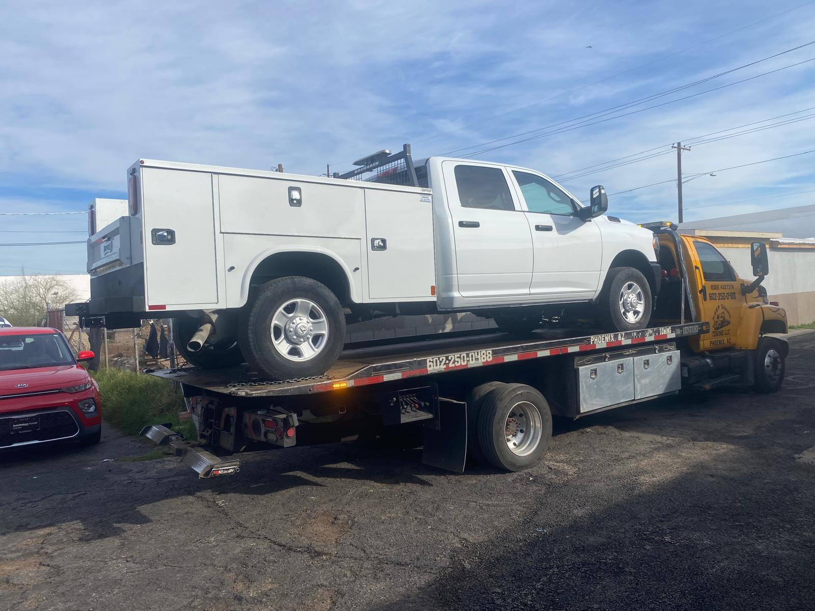 Work truck transported by Keep Going Towing